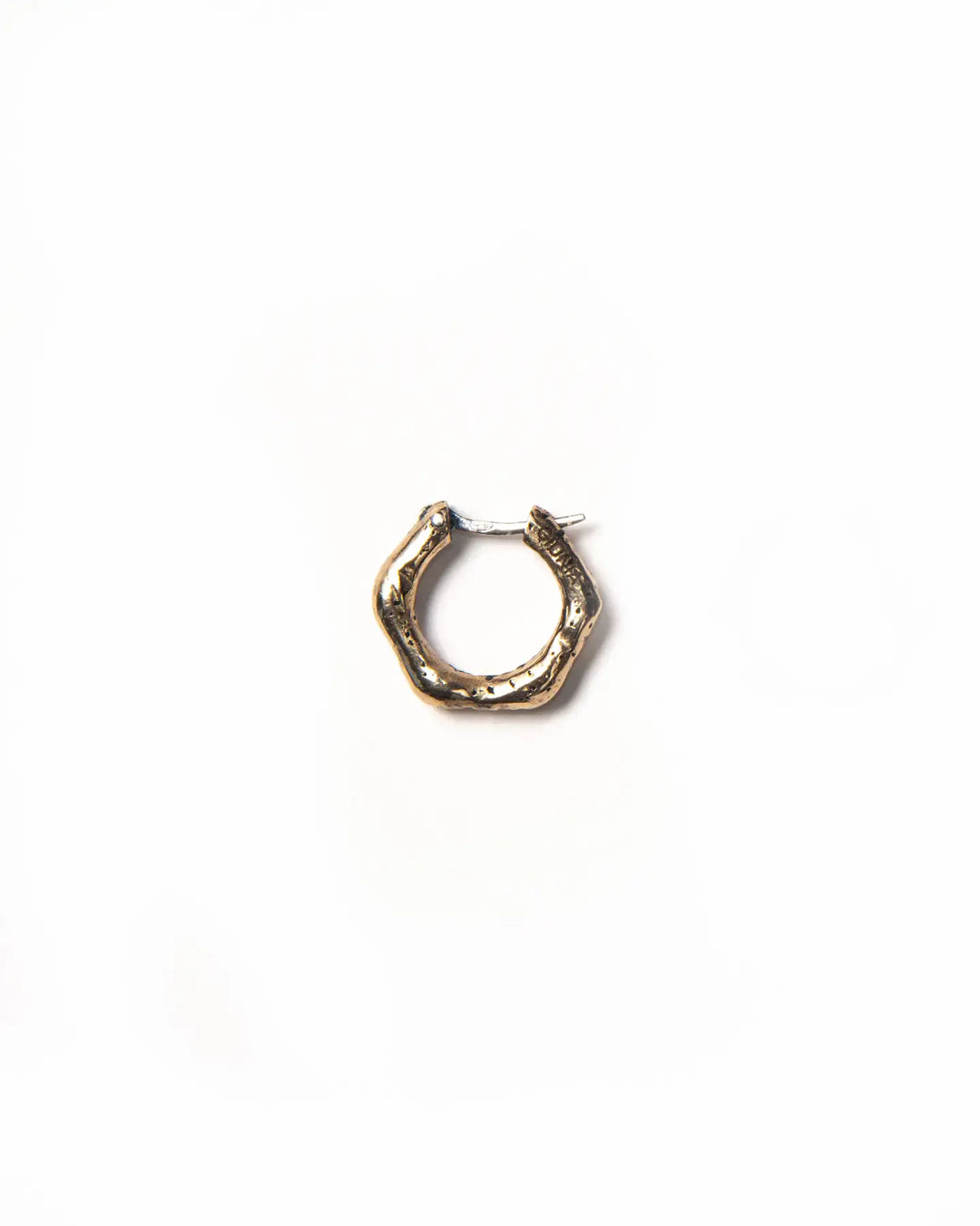 A timeless single bronze hoop earring with a textured finish.