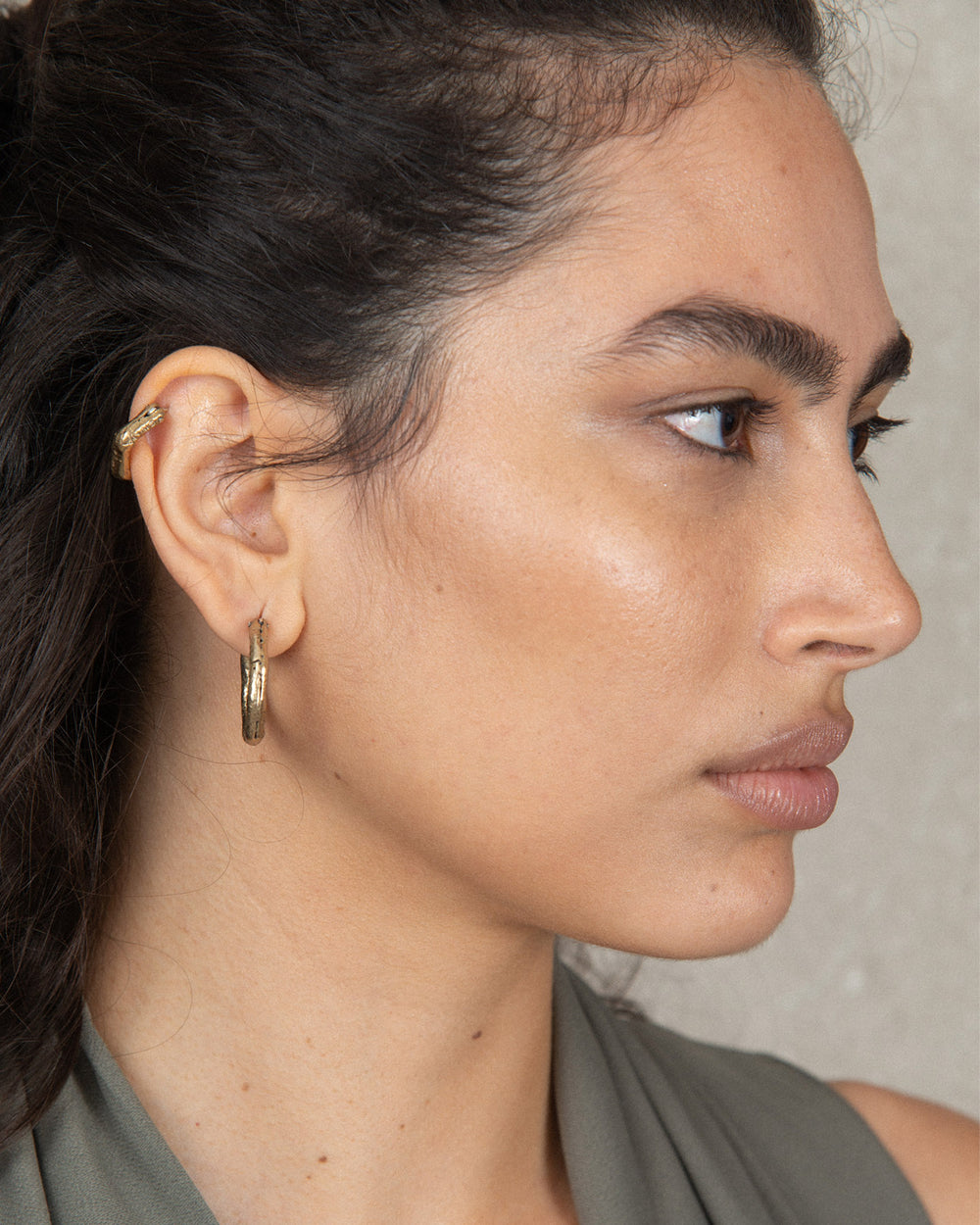 bronze classic hoops on a chic woman 