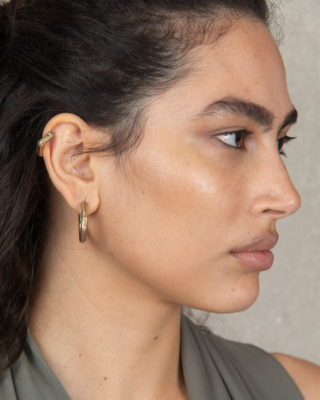 bronze classic hoops on a chic woman 