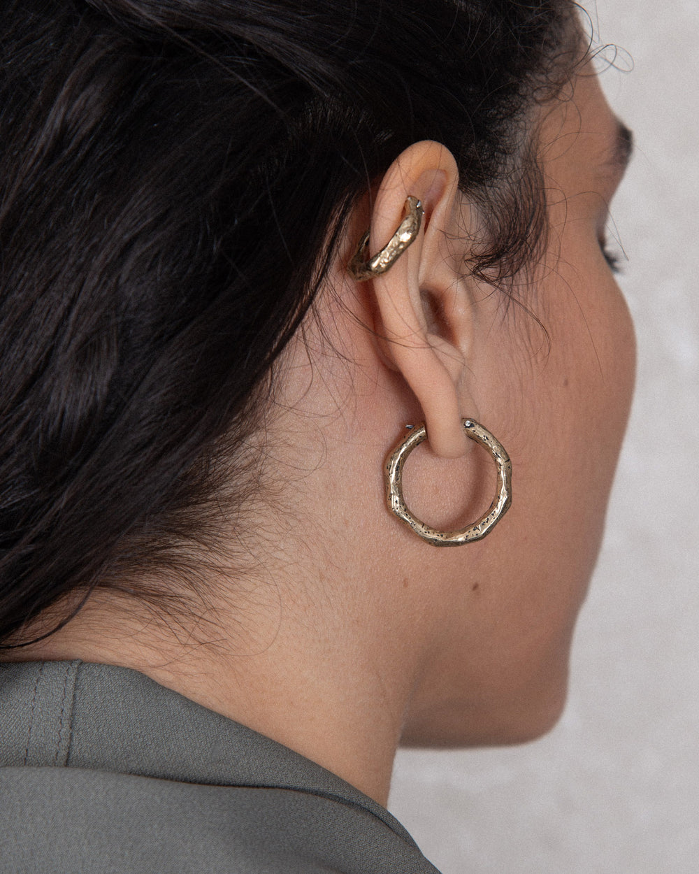 Detailed bronze hoop earrings with handmade feel