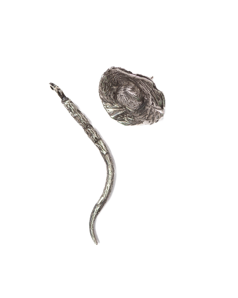 A still image displaying the silver mushroom flower and the stem as two separate pieces, with the flower featuring an earthy, textured finish and intricate surface details, and the stem designed to connect but shown detached, highlighting the modular nature of the jewelry.