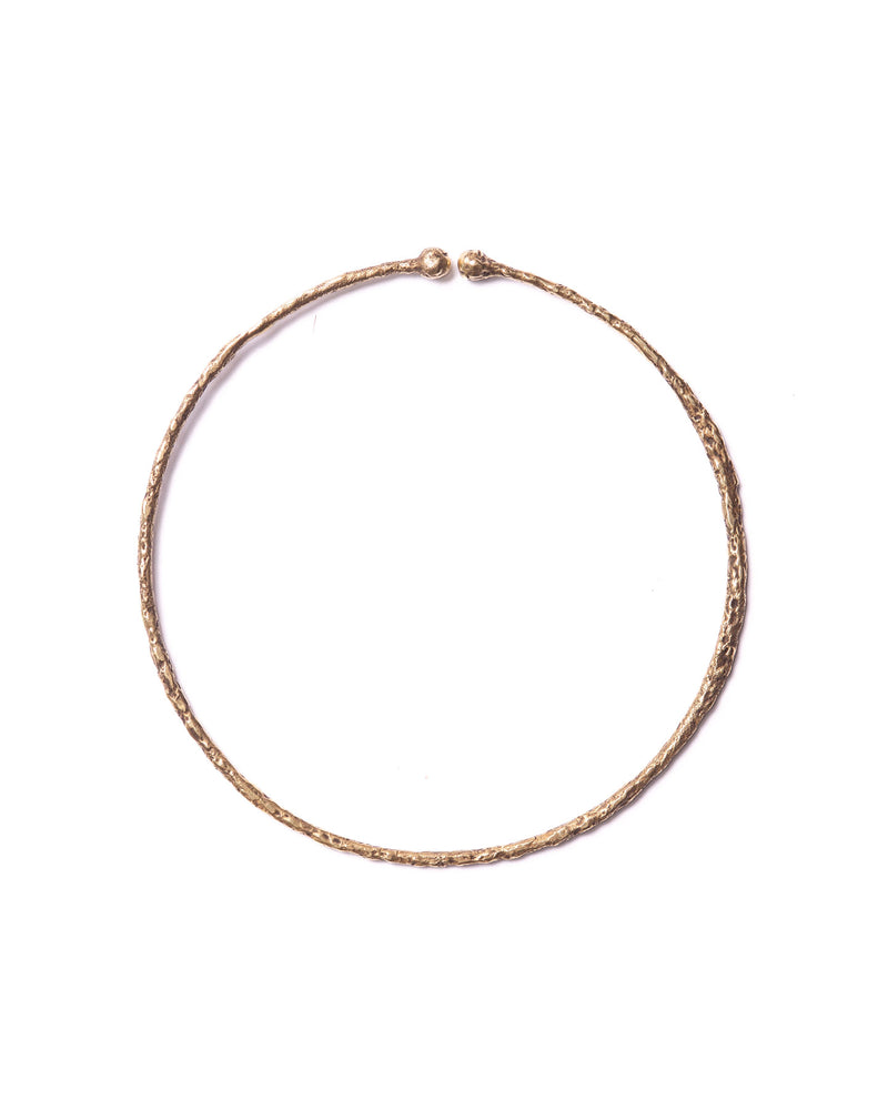 Front view of the large bronze hoop ear cuff with organic textures and bold design