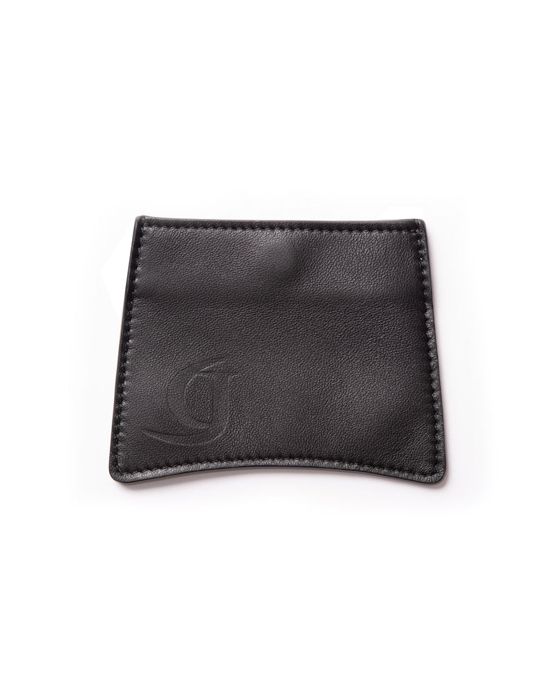 Minimalistic card wallet made from black upcycled leather with a stamped logo, showcasing sleek simplicity and sustainable craftsmanship