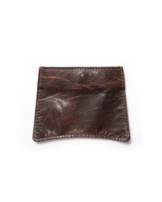 Back side of the shiny, textured upcycled leather card wallet with brown and black hints, highlighting clean and simple design