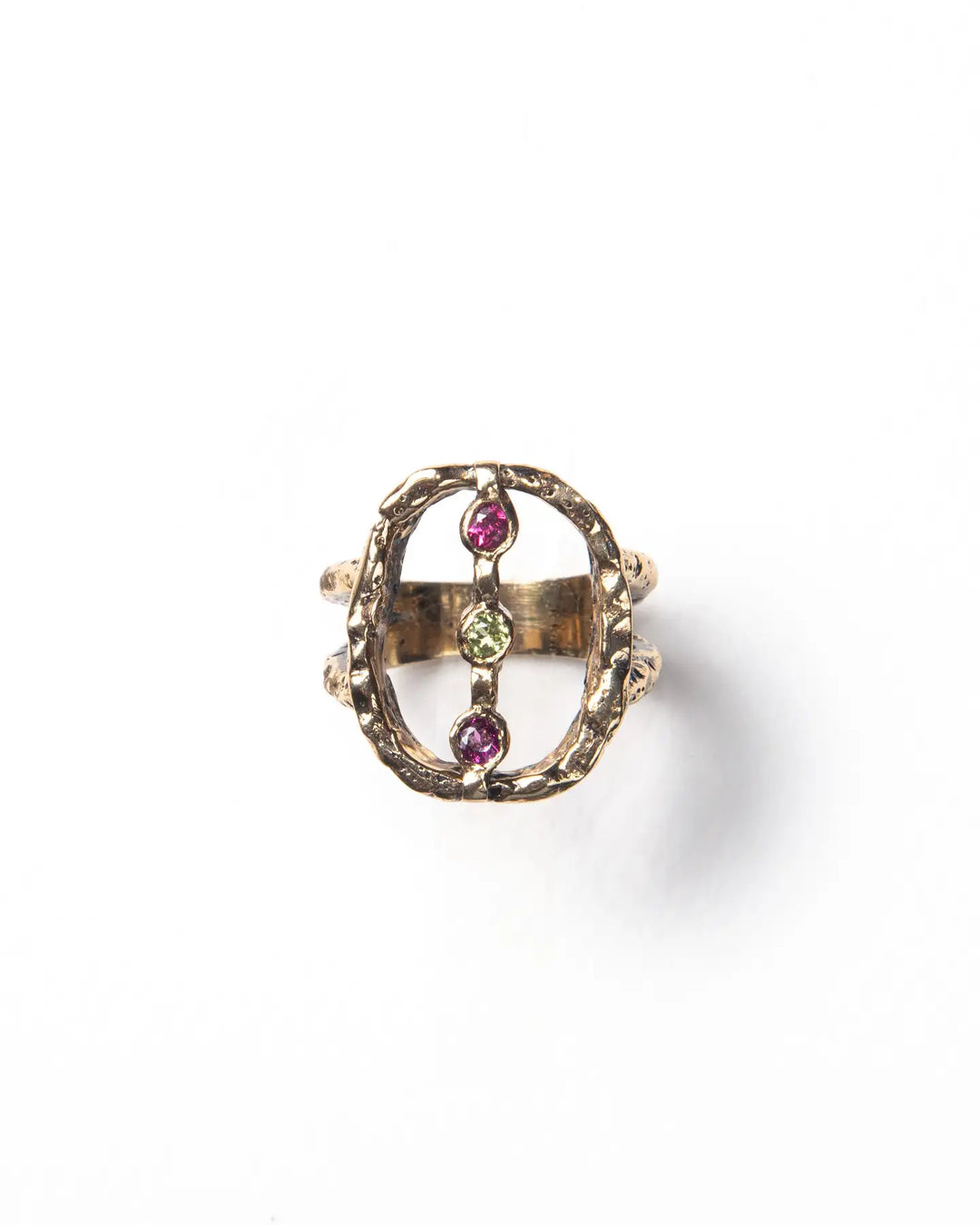 A bronze ring with a textured finish and adorned with natural stones
