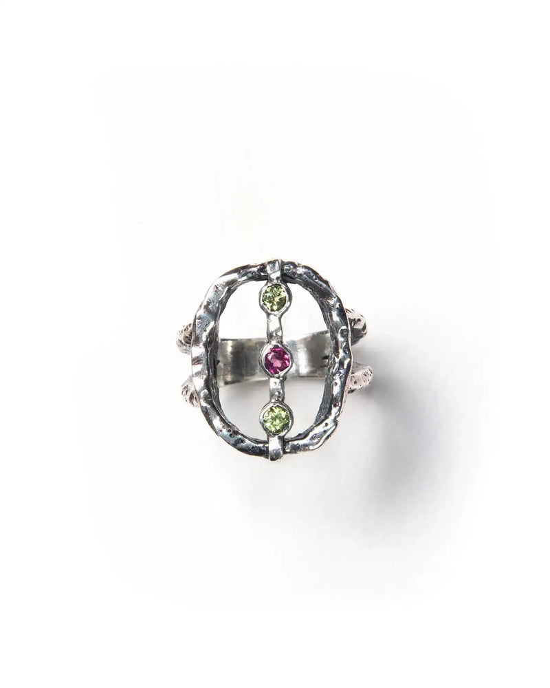Oval silver textured ring set with bright green and pink stones 