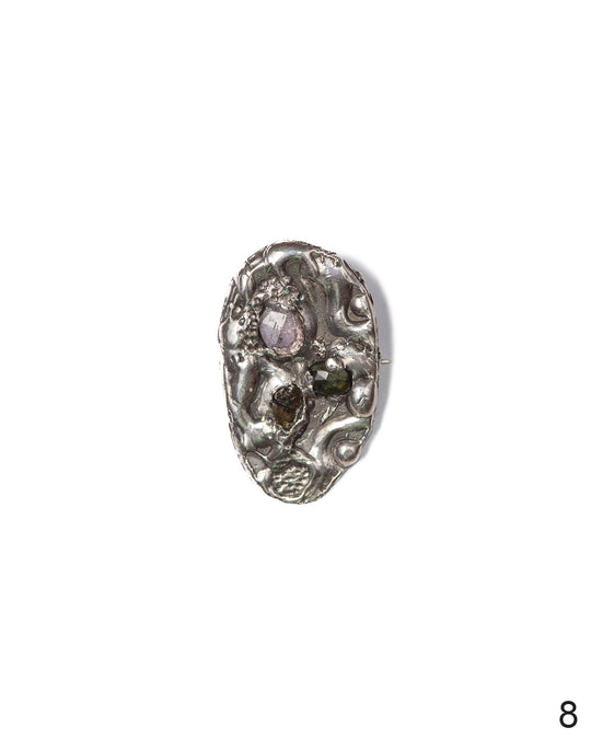 Silver brooch with intricate textured finish and unique watermelon tourmaline stones, an exclusive piece