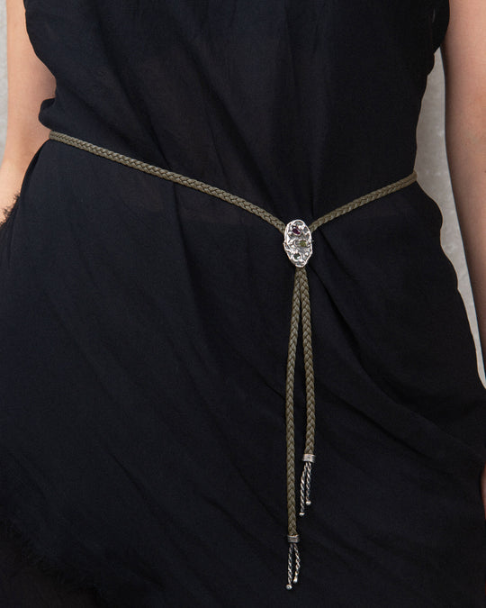 Handcrafted silver piece with textured surface and natural watermelon tourmalines, styled as a belt ornament