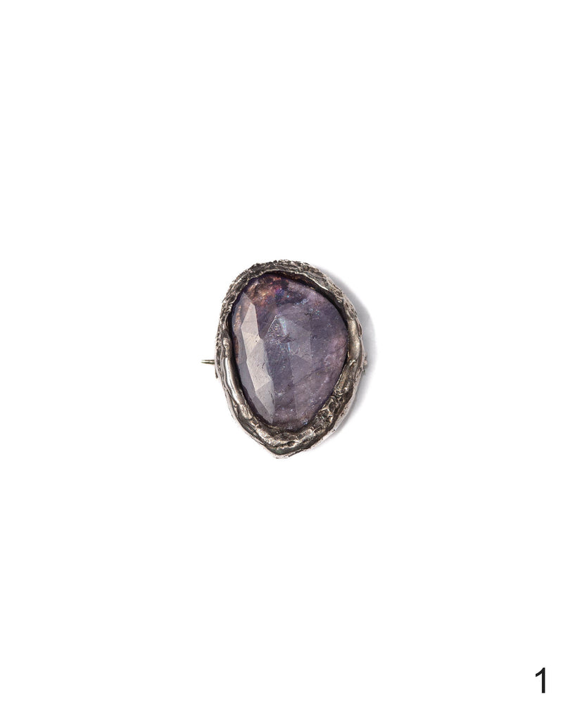 Elegant Kunzite charm with a textured silver frame, showcasing a delicate and luminous gemstone