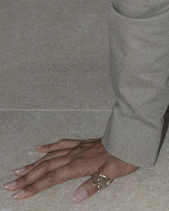 Gold ring worn on thumb finger