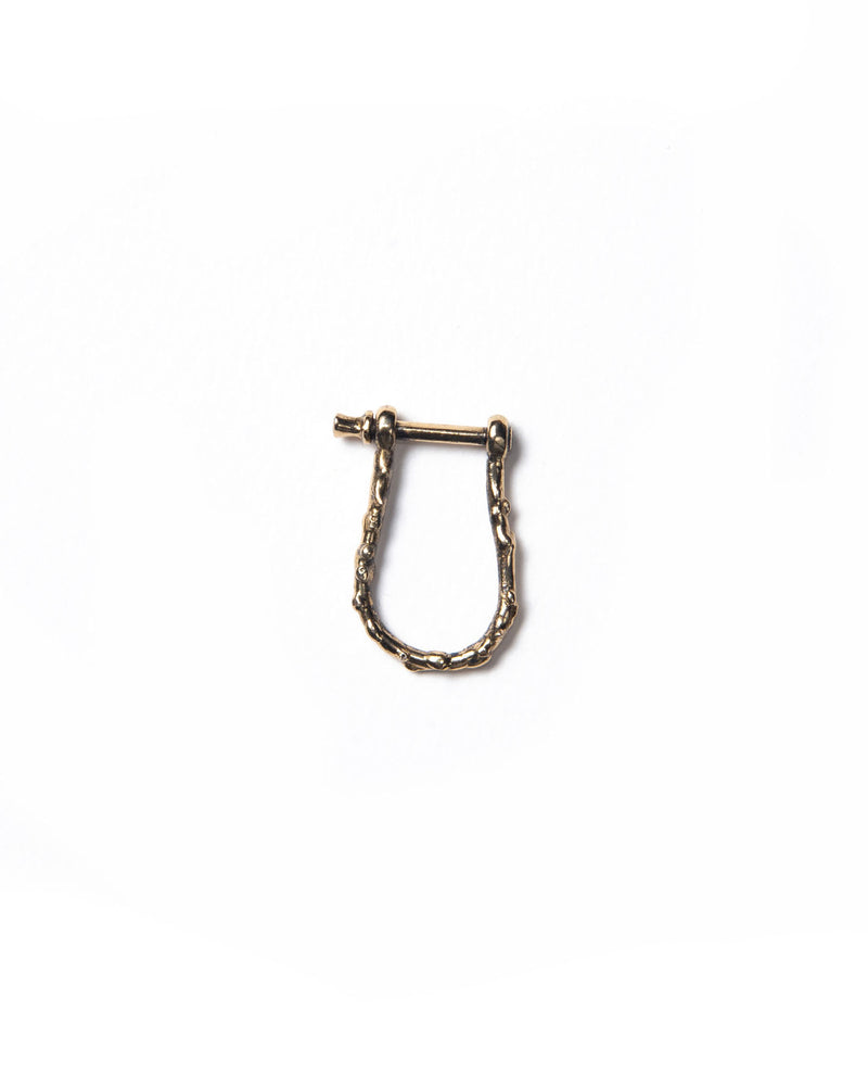 A bronze shackle clasp with a textured surface designed for attaching charms to jewelry items like necklaces or earrings.