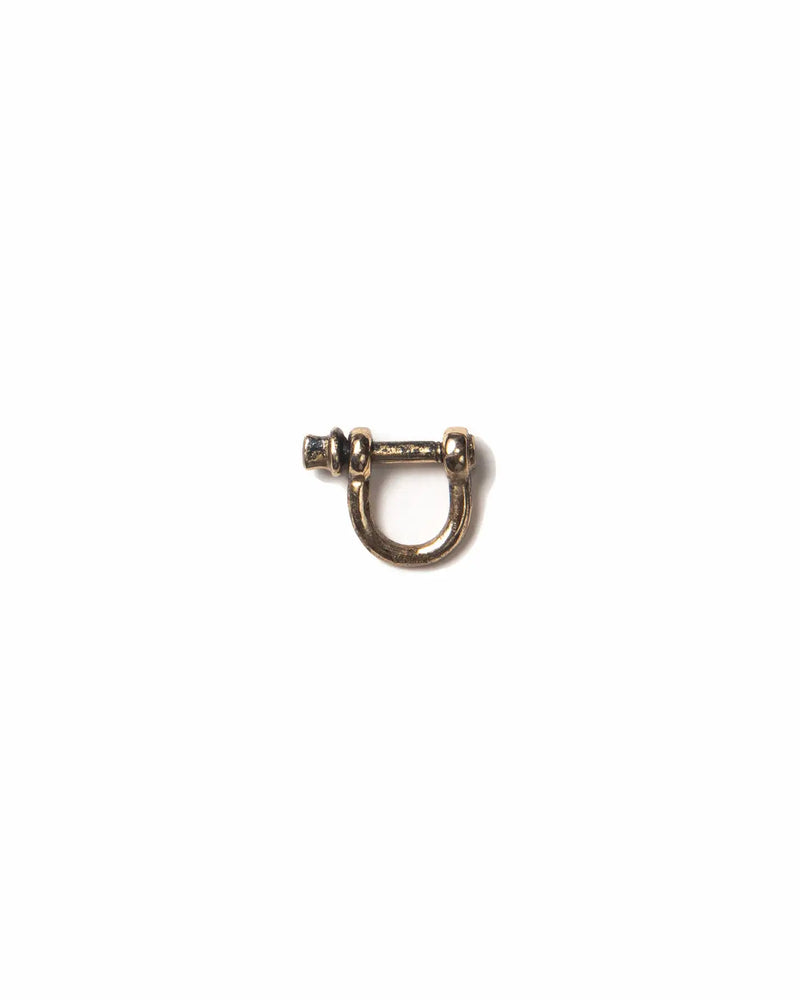 Small bronze shackle clasp used to connect a charm to a chain or earring.
