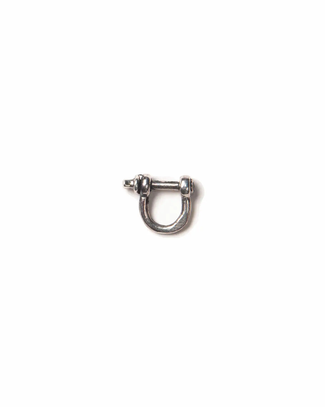 A small silver shackle clasp used to hook a pendants on chains or earrings