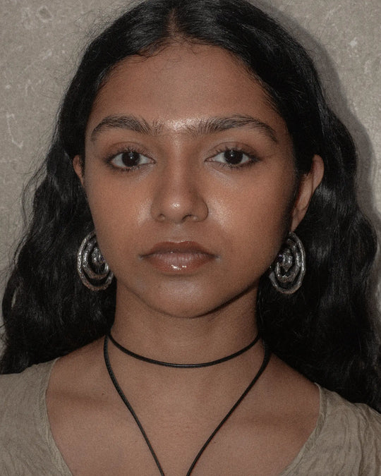 large silver earrings on a beautiful woman
